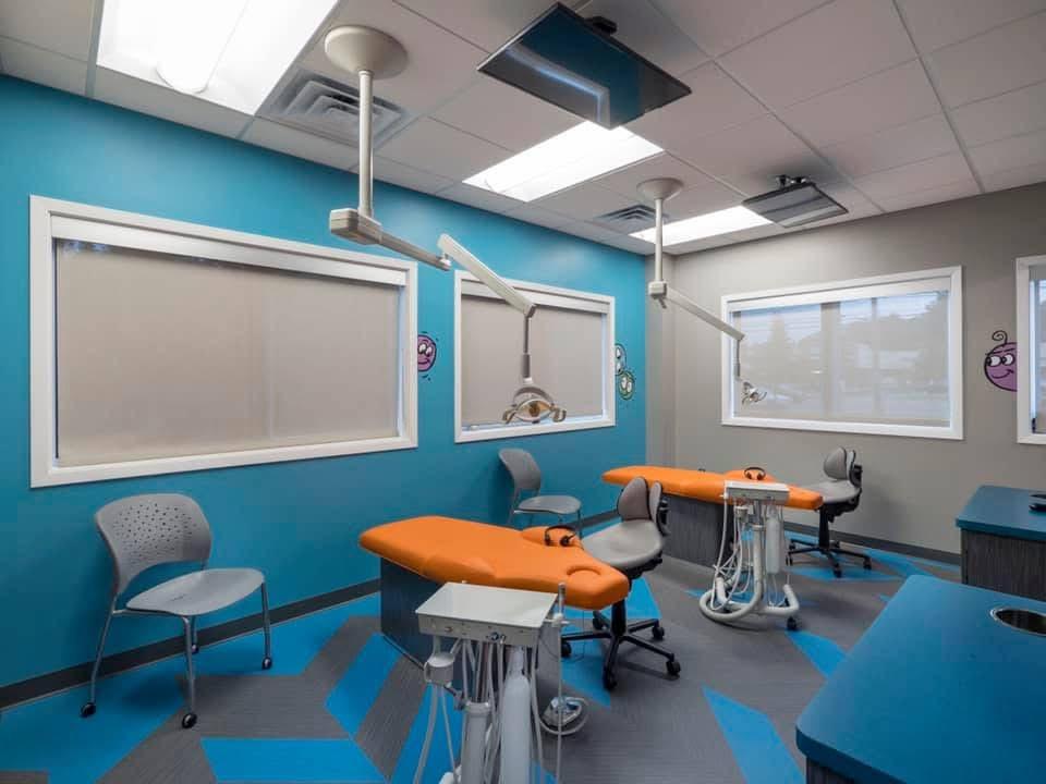Open Bay Treatment Area Playful wall mural inside the pediatric dental office